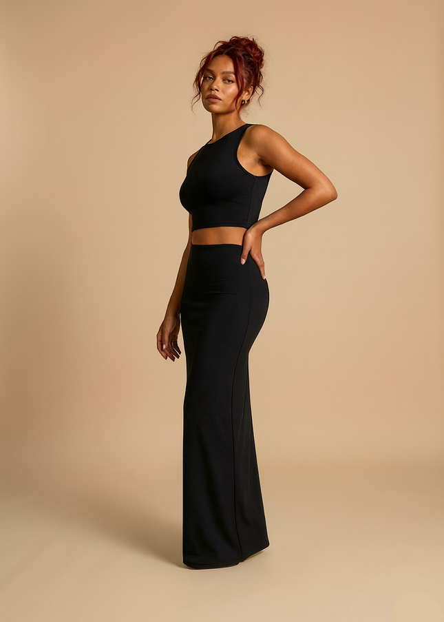 Black two-piece set with a cropped high-neck tank and high-waisted maxi skirt