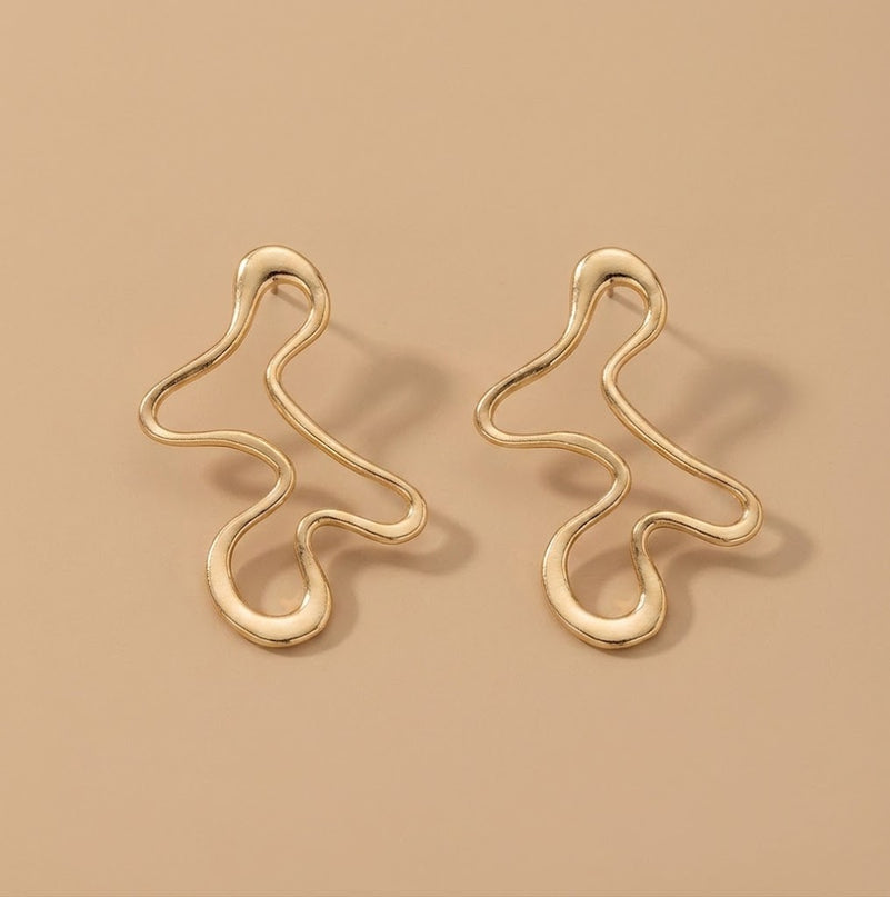 Close-up of the Ondine sculptural gold earrings, a baroque-style statement drop for autumn occasion wear