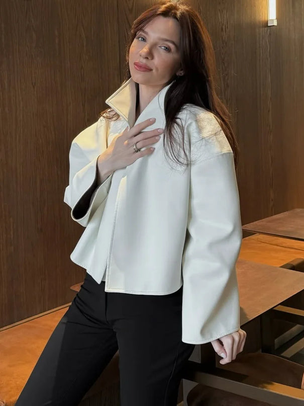 Cropped faux leather jacket with a high funnel collar and wide flared sleeves
