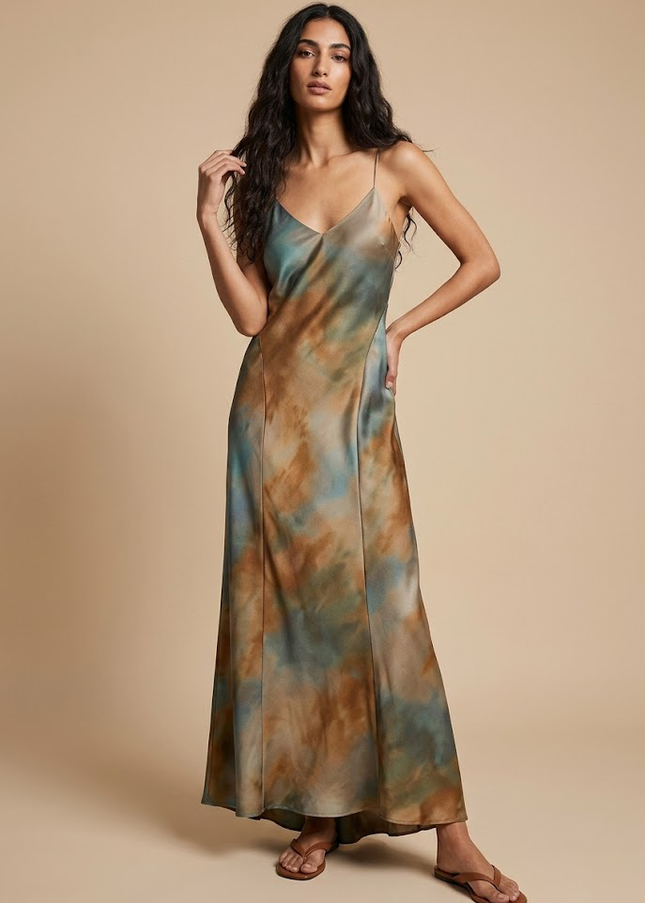Satin slip dress with a deep V neckline and open back in an abstract colour wash, the key fall 2026 fabric