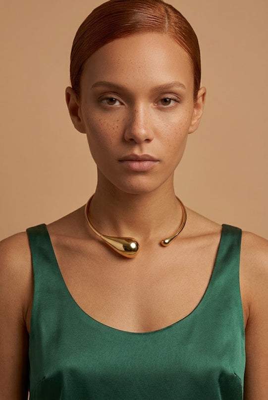 Chunky gold-tone statement choker necklace, an ornate layering piece for fall 2026 going-out looks